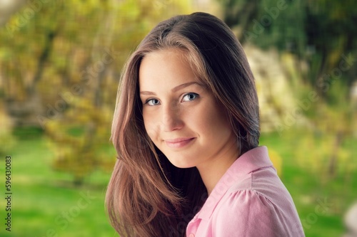 Young happy woman portrait on outdoor background