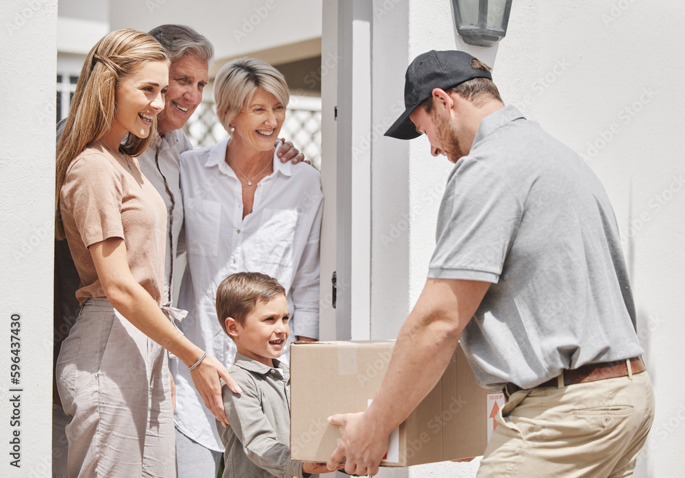 Obraz premium Heres your package, sir. Cropped shot of an adorable little boy collecting his familys delivery from a male courier.