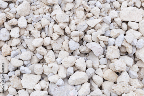 A lot of white stones, limestone type. It is ideal for compositions with textures and backgrounds. photo