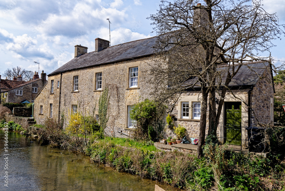 Pretty cottages and the Mells River at Nunney