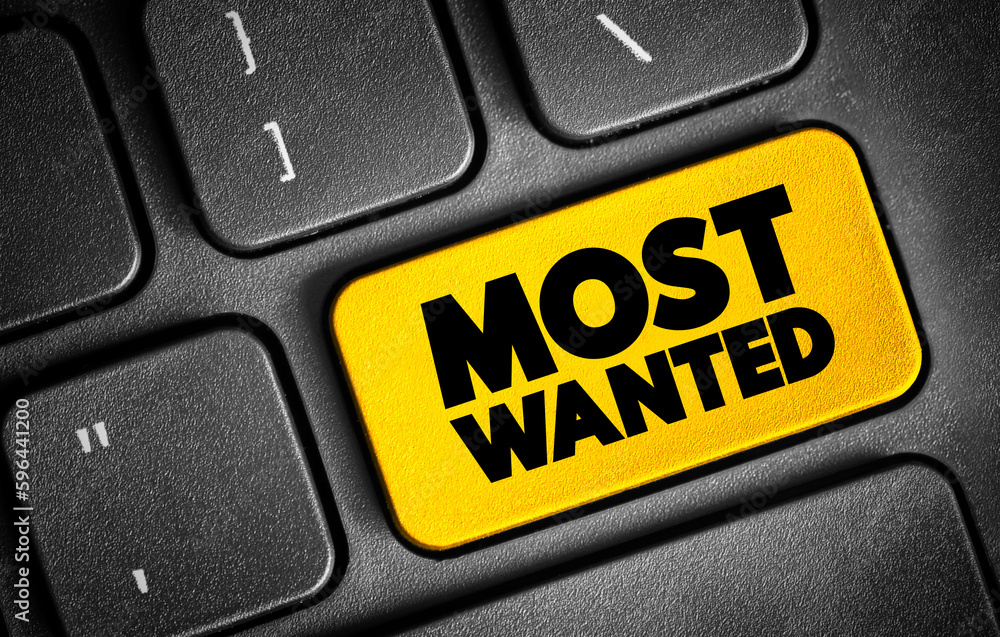 Fototapeta premium Most Wanted text button on keyboard, concept background
