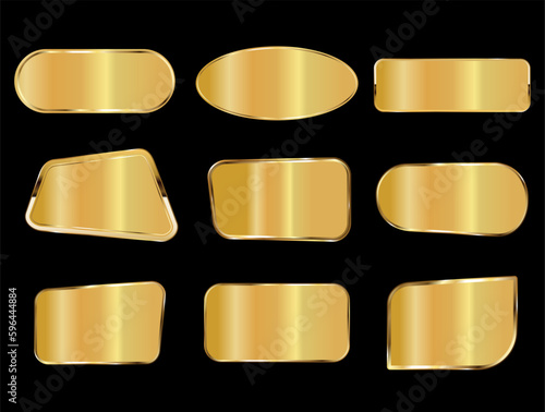 Golden metal plates collection on black background