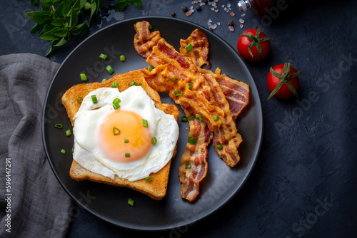 Fried eggs with bacon. Baco...