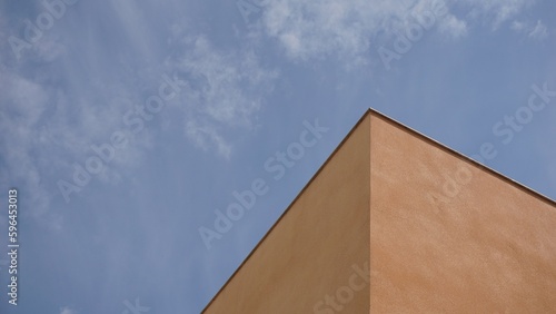 cornice corner of building against cloudy sky