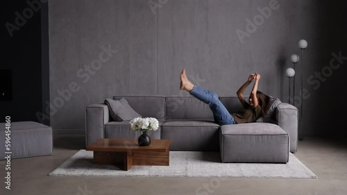 Young woman jump on the couch and relaxing