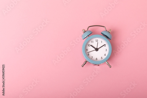 Alarm clock on color background.Good morning concept. Morning time concept. retro alarm clock on background. WAKE UP. Good morning. flat lay.Banner.