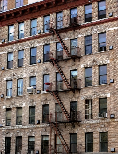 The facade of a building in New York with the external fire escape ladder.