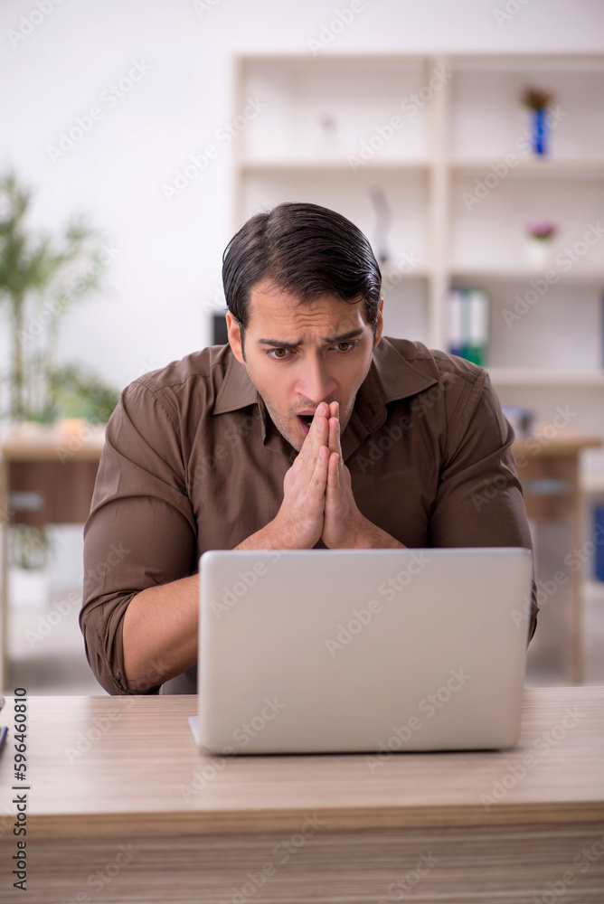 Young attractive employee sitting in the office Young attractive employee sitting in the office