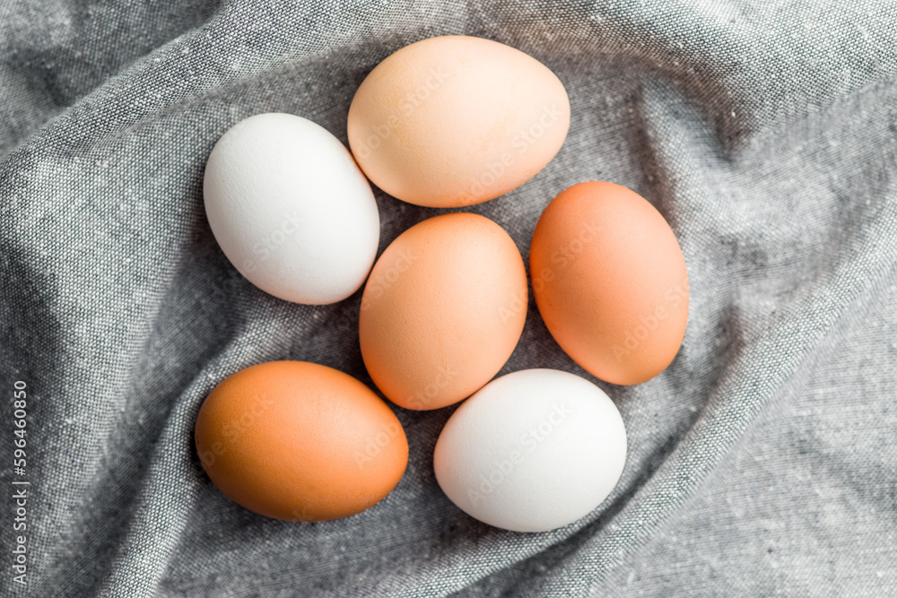 Whole chicken eggs on kitchen napkin. Top view. Whole chicken eggs on kitchen napkin. Top view.
