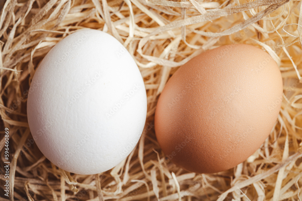 Whole chicken eggs on straw. Top view. Whole chicken eggs on straw. Top view.