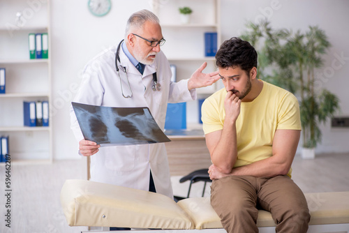 Young male patient visiting old male doctor radiologist © Elnur