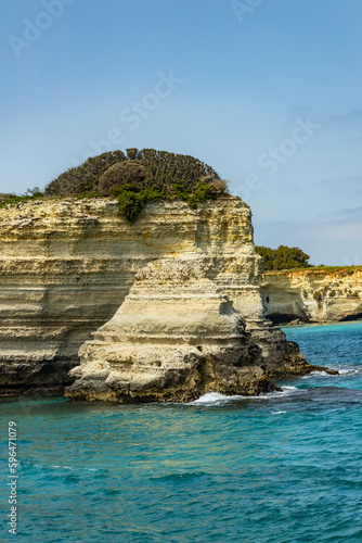 Faraglioni of Sant'Andrea, Puglia. Evocative spectacle, on a cliff overlooking the sea with caves, inlets and wild animals, in short, a world to discover. Long exposure during a windy day.