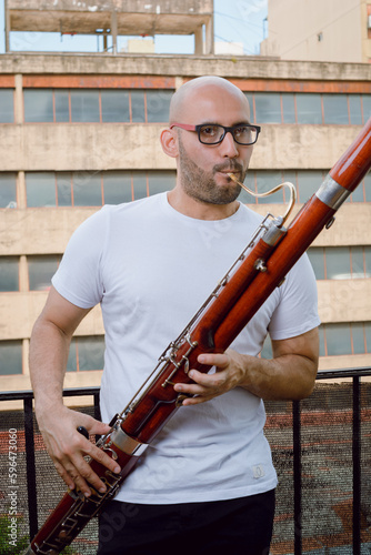 portrait of a Venezuelan man musician of the Simon Bolivar Symphony Orchestra at homen photo