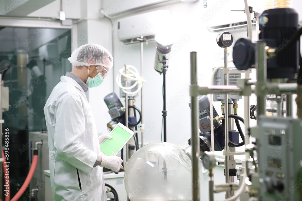 scientist analyzing a biological and ecological hemp plant used for herbal pharmaceutical CBD oil and THC oil in a laboratory. scientist analyzing a biological and ecological hemp plant used for herbal pharmaceutical CBD oil and THC oil in a laboratory.