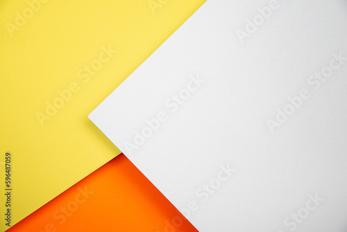 Beautiful 3-D background made of colored paper. Yellow, orange and white.
