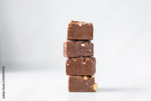 Quadro em tela chocolate fudge with nuts on a marble tray, chocolate fudge cut into pieces, fud