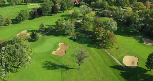 Aerial view of a suburban Chicago golf course in early morning with fairways and sand traps in Glencoe, IL. photo