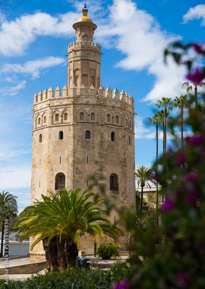View of Tower of gold (Torre del Oro) in Spanish city of Seville in sunny spring day