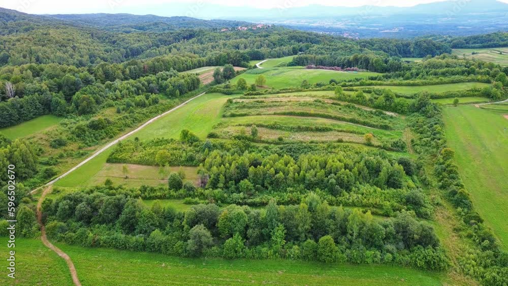 Valley with fields, meadows, agricultural farms, forests and houses Valley with fields, meadows, agricultural farms, forests and houses