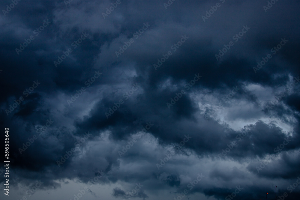 Dark stormy sky with heavy clouds.
Climate change concept.