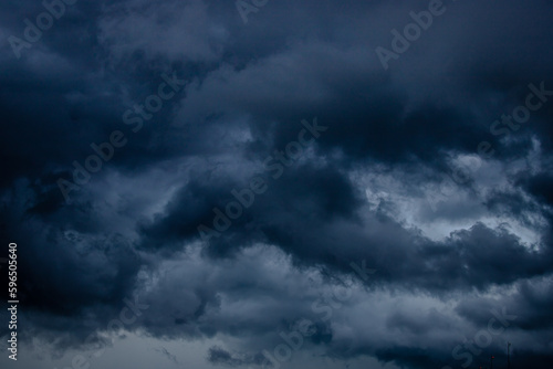 Dark stormy sky with heavy clouds. Climate change concept.
