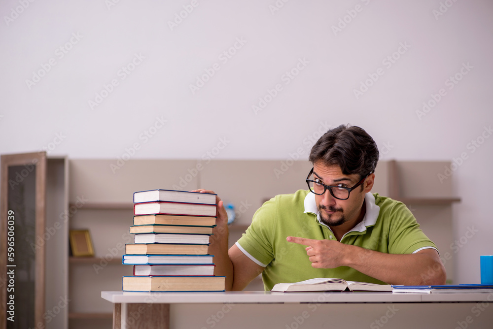 Young male student studying at home Young male student studying at home