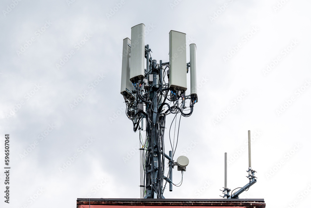 Cell phone transmission systems on the roof of an apartment building in East Toronto, Ontario Canada