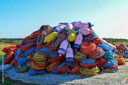 Fotografija Bundles of commercial nylon woven fishing line orange, yellow, blue, and green in color