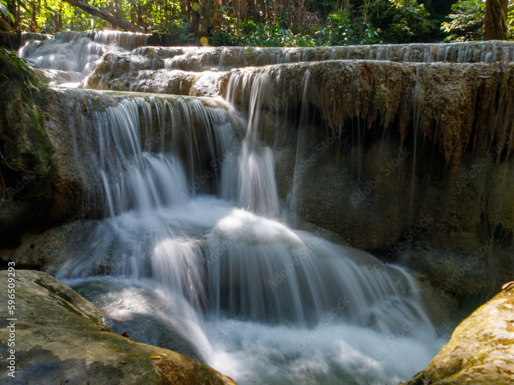 Fototapeta premium Landscape view of Erawan waterfall Kanchanaburi Thailand. Erawan National Park is home to one of most popular falls in Thailand. Fifth floor of Erawan waterfall Buea Mae Long