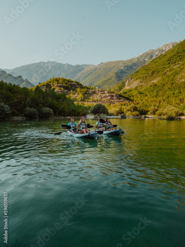 A group of friends enjoying having fun and kayaking while exploring the calm river, surrounding forest and large natural river canyons