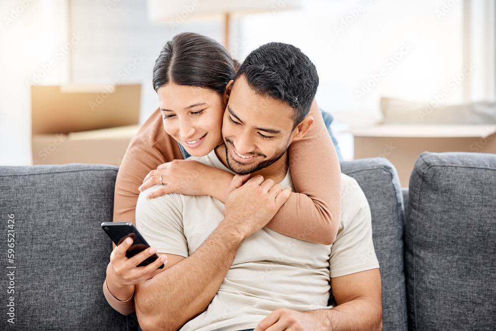 We can shop online for everything we need. Shot of a young couple using a cellphone while moving house. We can shop online for everything we need. Shot of a young couple using a cellphone while moving house.