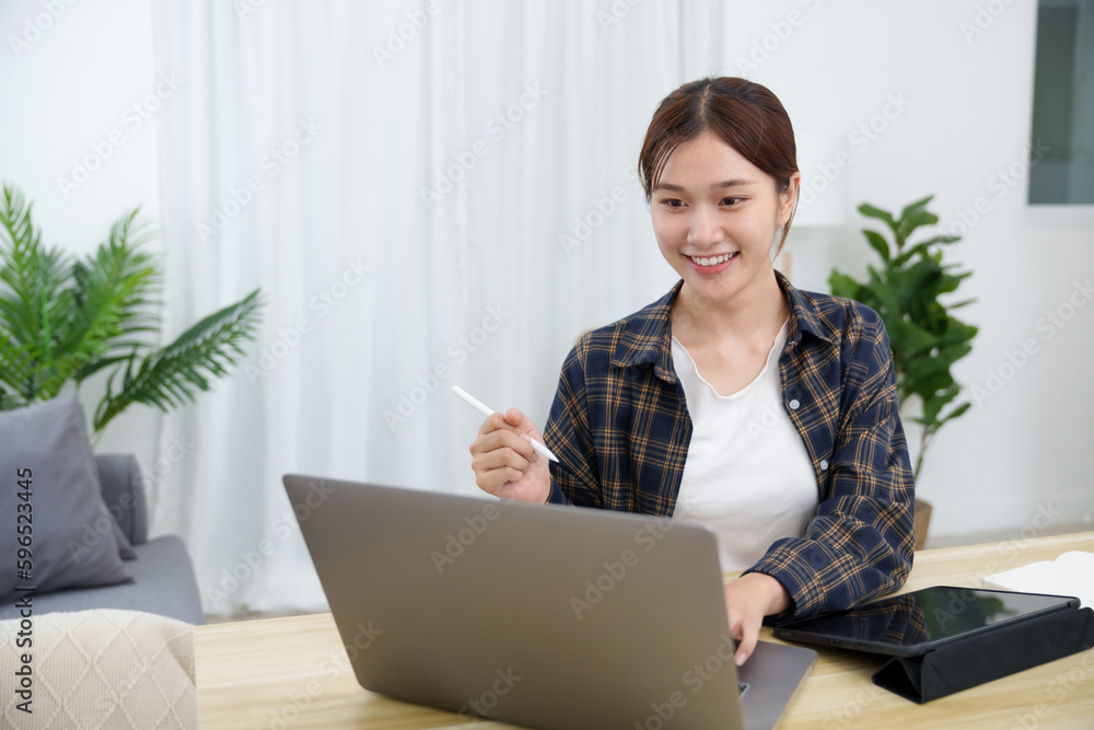 Happy asian woman speak conference on laptop in video call people smart working from home. Happy asian woman speak conference on laptop in video call people smart working from home.