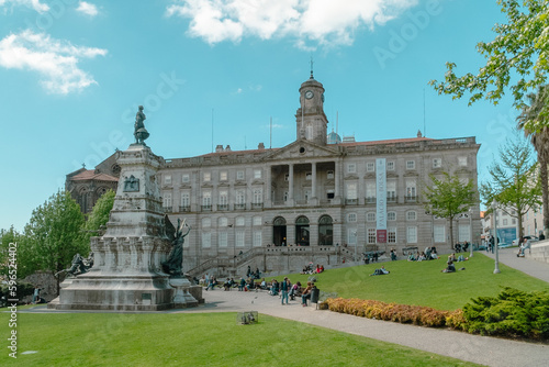 Oporto, Portugal. April 13, 2022: Stock Exchange Palace and Don Henrique Statue. photo