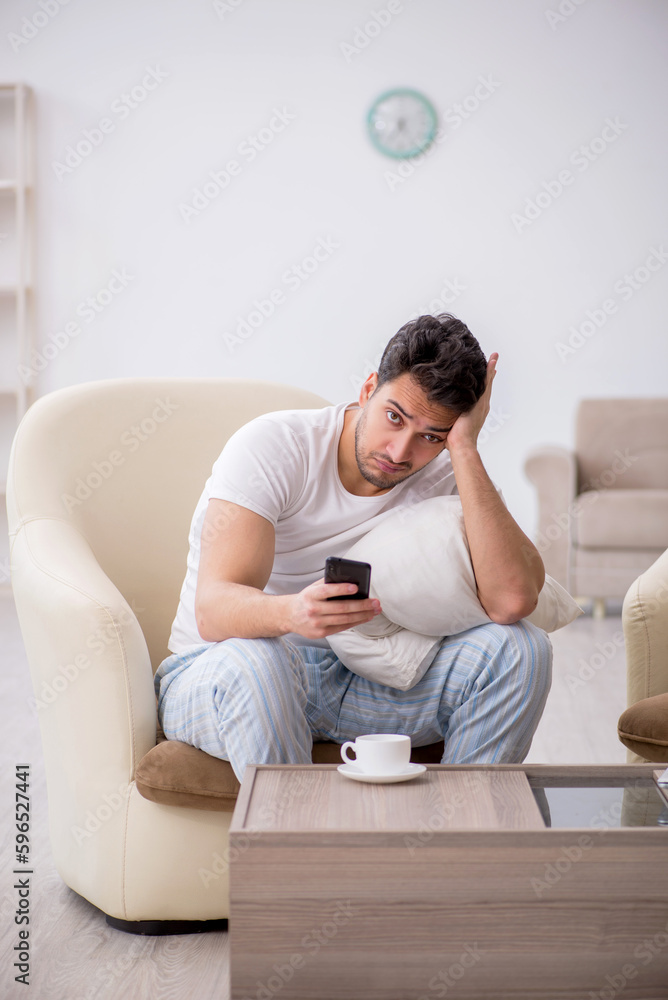 Fototapeta premium Young man starting day at home