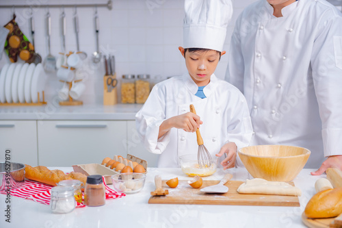 father and son cooking