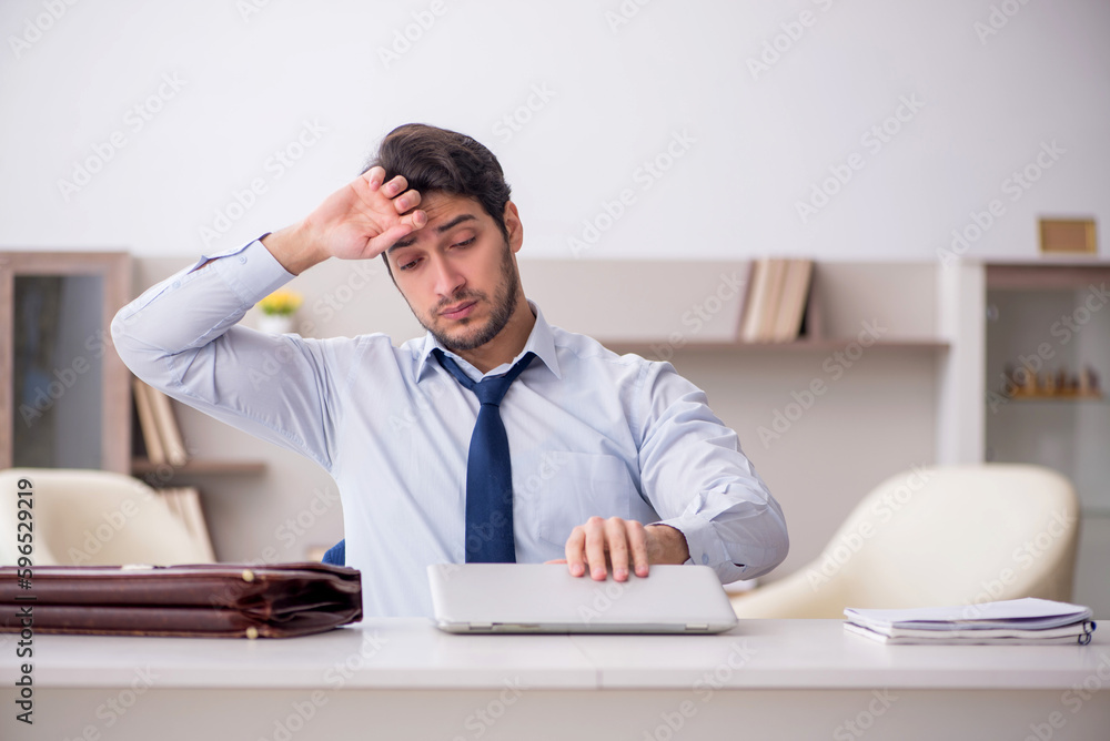 Young male employee working from home during pandemic Young male employee working from home during pandemic
