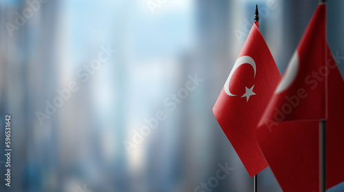 Small flags of the Turkey on an abstract blurry background photo