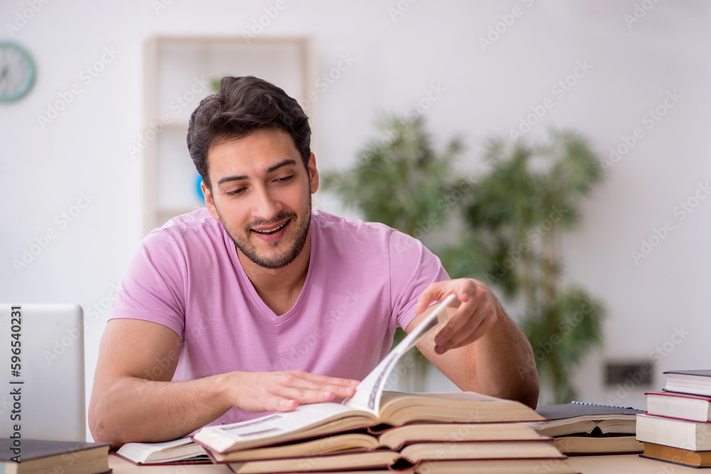 Young male student sitting in the classroom Young male student sitting in the classroom