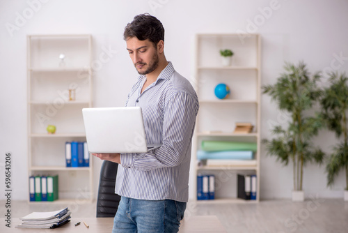 Young male student employee in tele-education concept