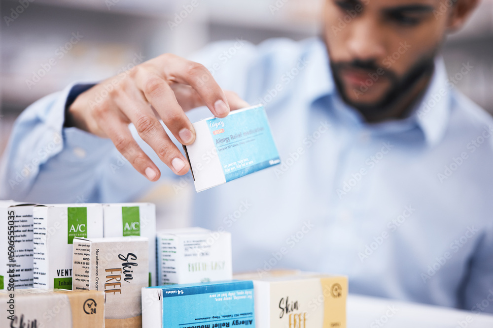 Pharmacy stock, man hands and retail check of a customer in a healthcare and wellness store. Medical inventory, drugs box and pharmaceutical label information checking of a person by a shop shelf