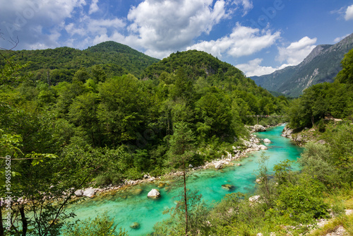 Bild auf Leinwand Turquoise colored soça river near Kozjak waterfall in Slovenia