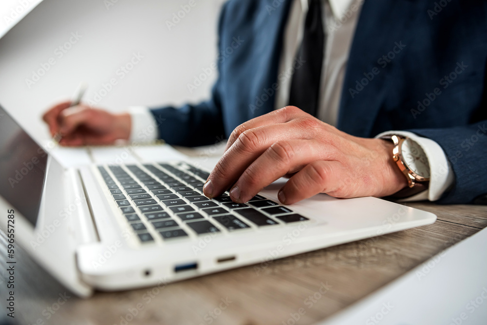 Business man wear suit working with laptop at office Business man wear suit working with laptop at office