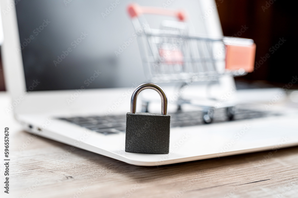 Black lock on the white laptop keyboard close up