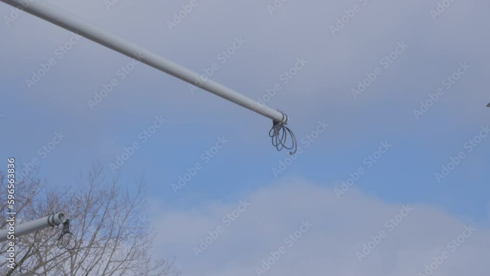 Protruding cables from the structure for fixing traffic lights at the intersection - zoom out Protruding cables from the structure for fixing traffic lights at the intersection - zoom out