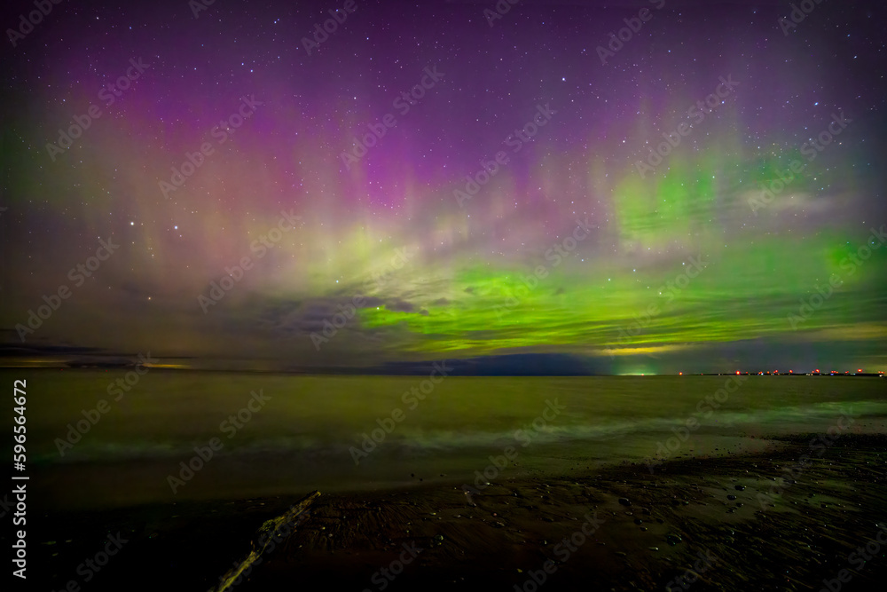 Spectacular Northern lights also known as aurora borealis in Southern Ontario over lake Huraon, Canada