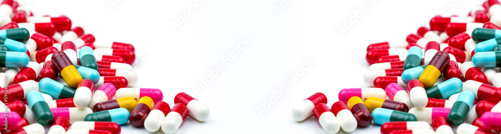 Frame of colorful antibiotic capsule pills. Pile of antibiotic capsule pills. Antibiotic drug resistance concept. Prescription drug. Pharmaceutical industry. Healthcare and medicine. Medical care. Frame of colorful antibiotic capsule pills. Pile of antibiotic capsule pills. Antibiotic drug resistance concept. Prescription drug. Pharmaceutical industry. Healthcare and medicine. Medical care.