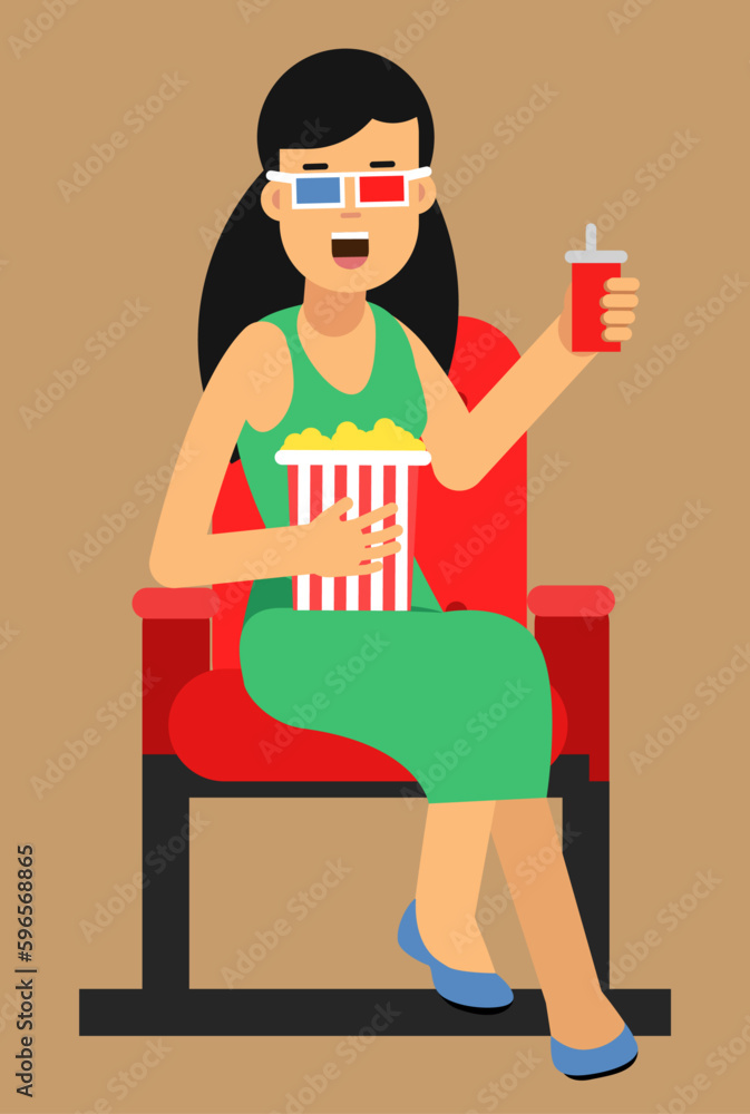 woman in green dress sitting in the cinema