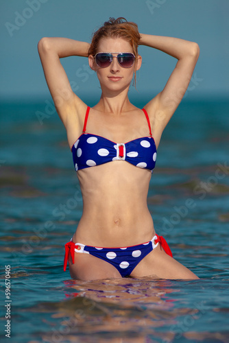 Beautiful woman in bikini on the beach © zhagunov_a