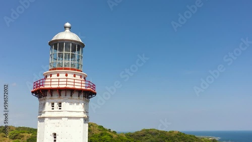 Aerial view of Lighthouse on hill. Cape Bojeador Lighthouse, Ilocos Norte, Philippines. photo