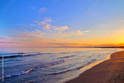 Sunrise over the city beach on the Spanish coast.